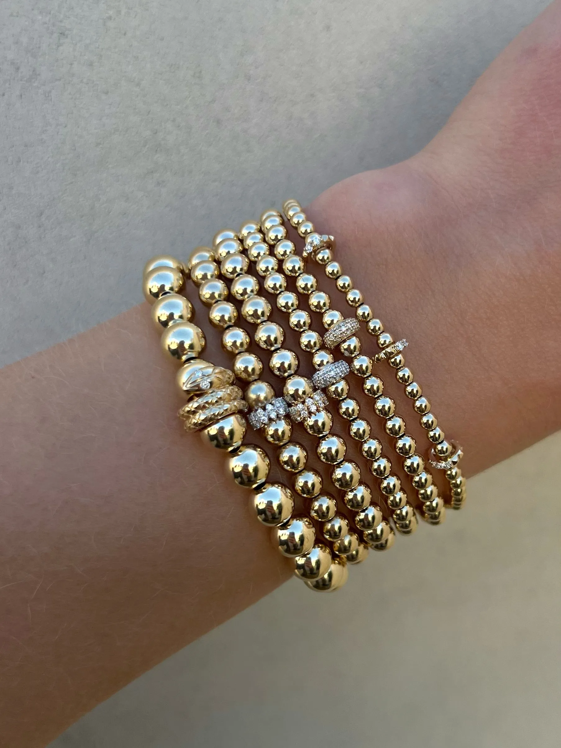 7mm Signature Bracelet with a 14k Snake Rondelle