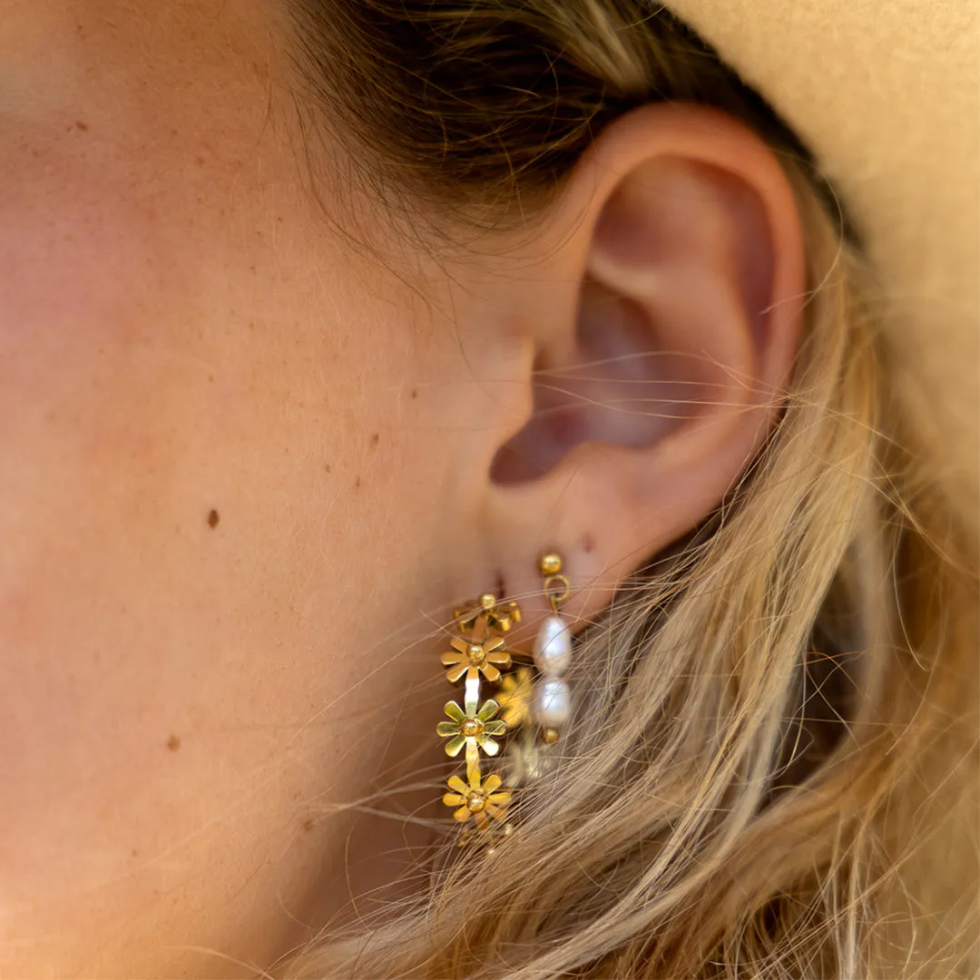 Gold coloured hoop earrings with flowers