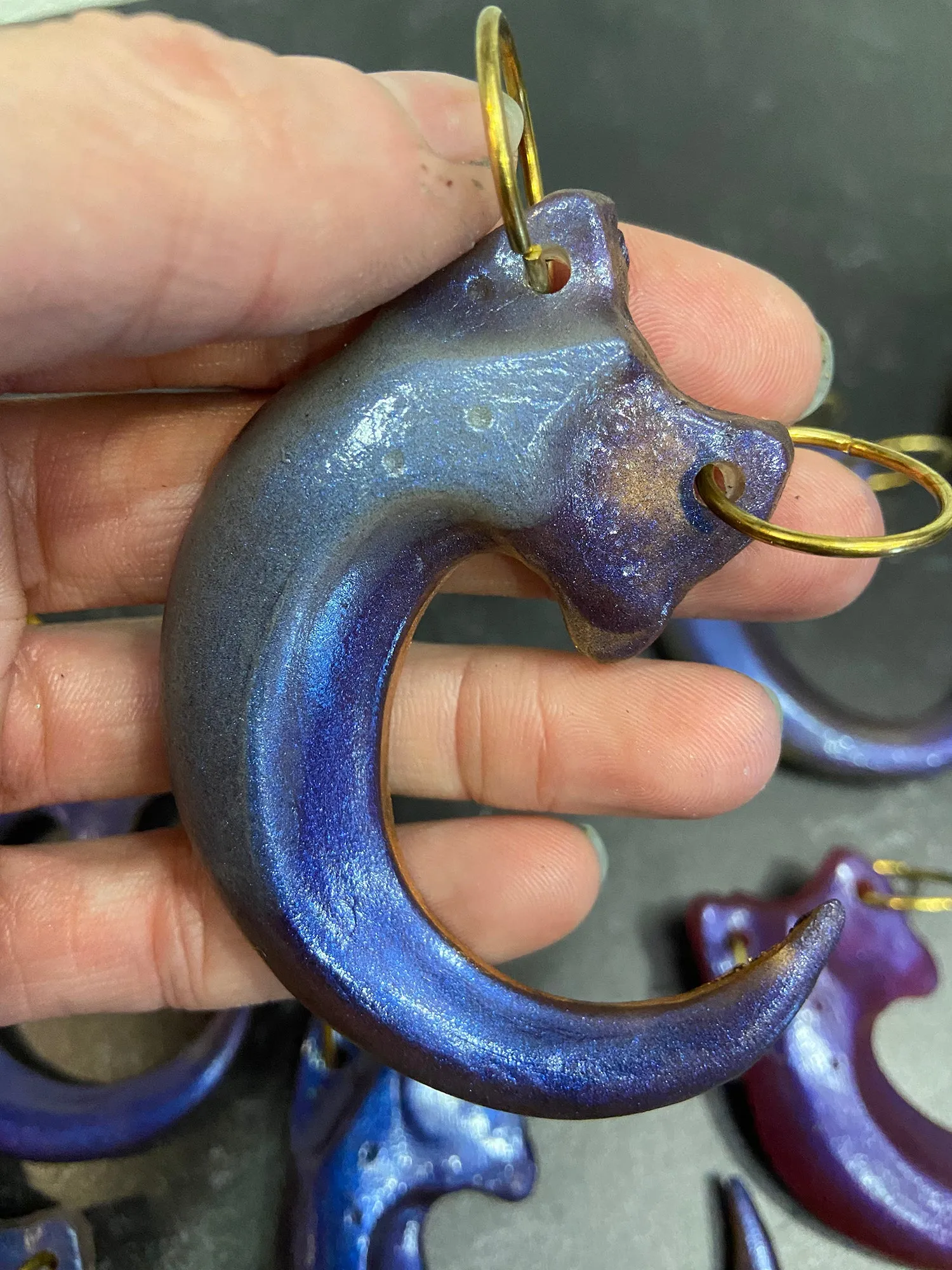 IRIDESCENT PURPLE CLAW PENDANT