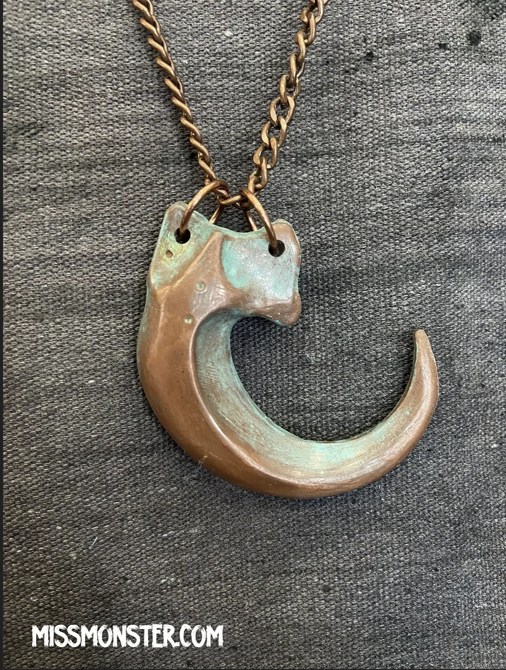 IRIDESCENT PURPLE CLAW PENDANT