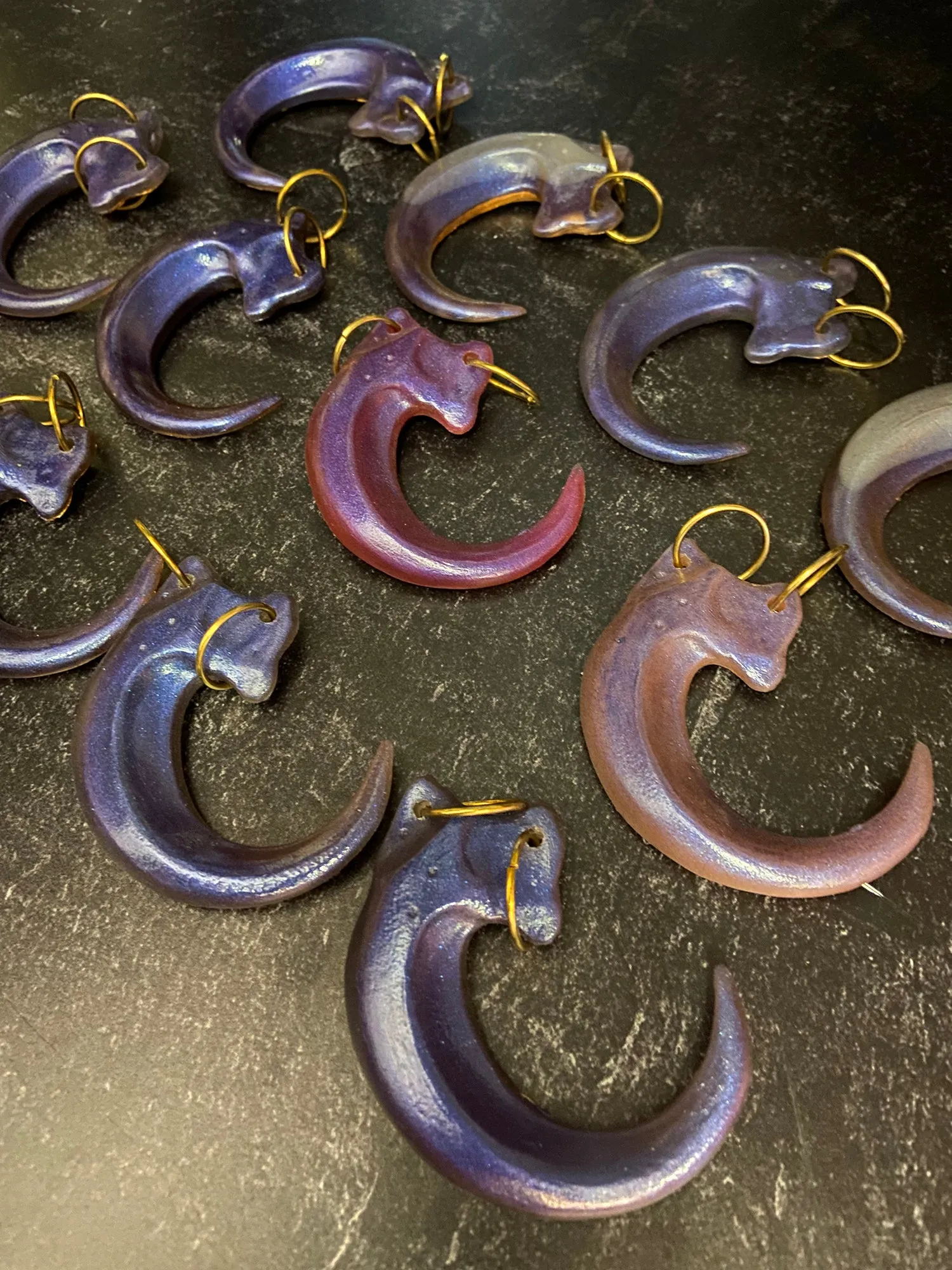 IRIDESCENT PURPLE CLAW PENDANT